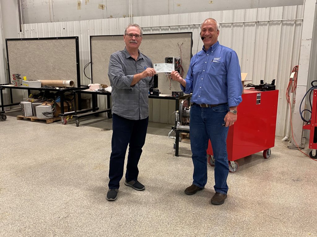 John Winchmann presents Sewer Equipment's Donation to Dixon Habitat for Humanity