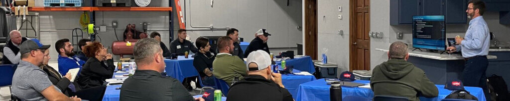 A group of people taking a sales class