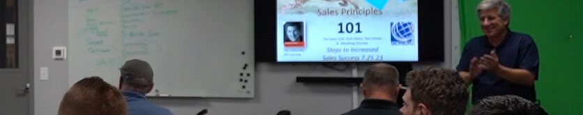 Picture of someone teaching the Sales Principles 101 class